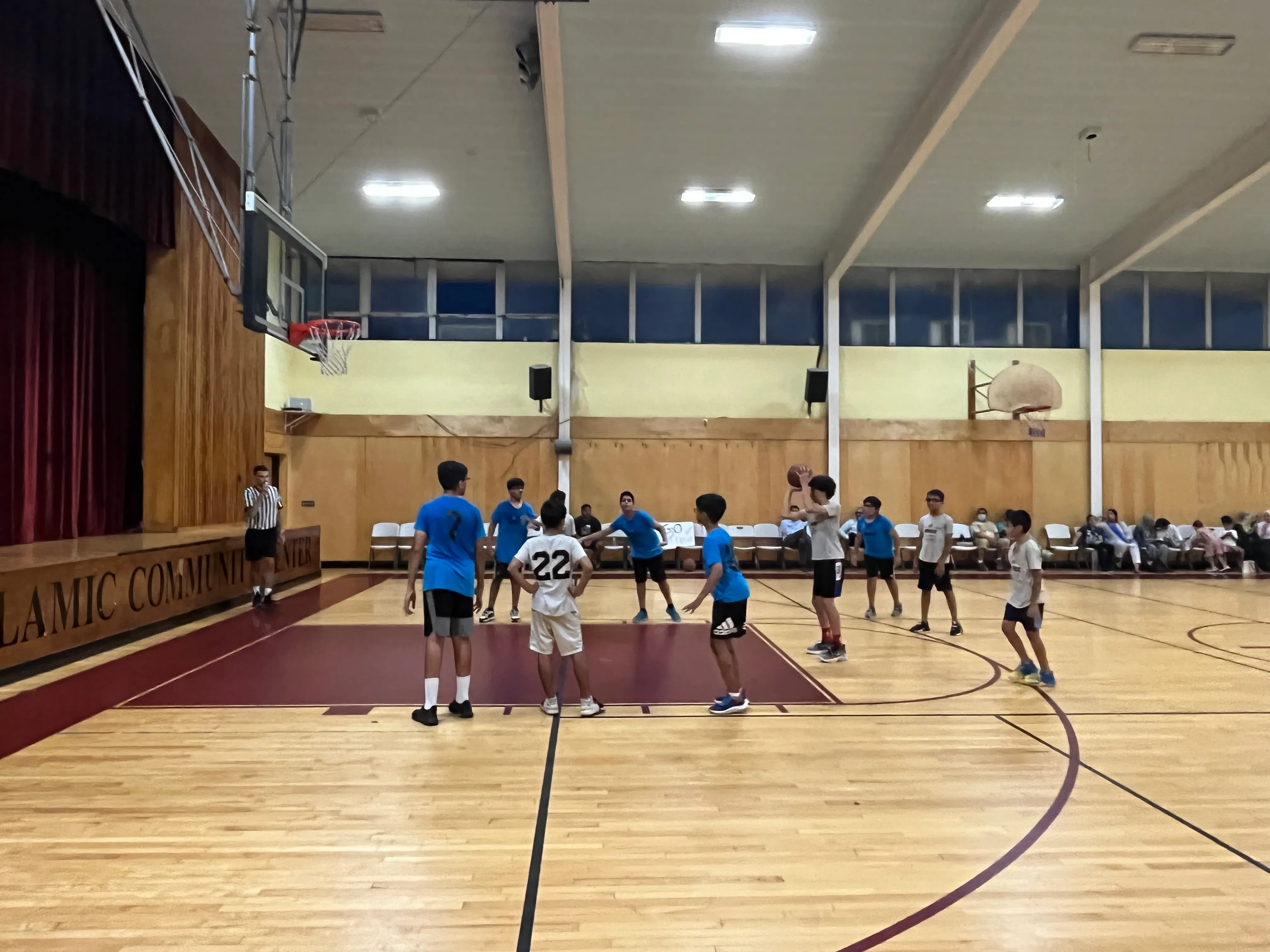 kids taking free throw in basketball game